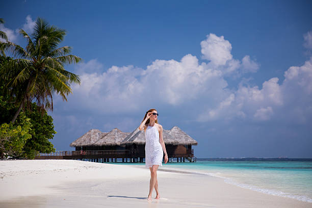 istock Woman on the tropic beach 516897922