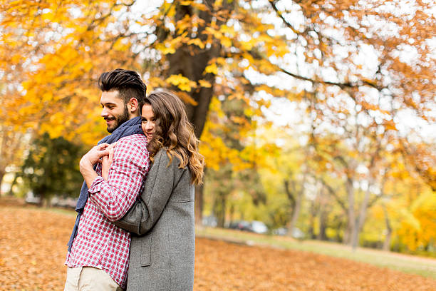 istock Young couple in the autumn park 516898024