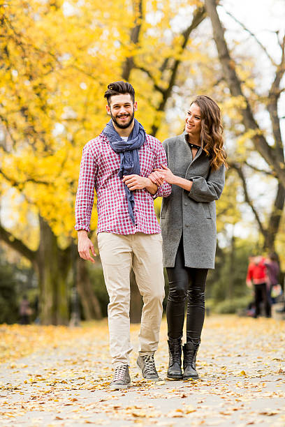 istock Young couple in the autumn park 516899448