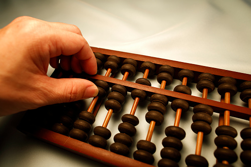 Hand with abacus