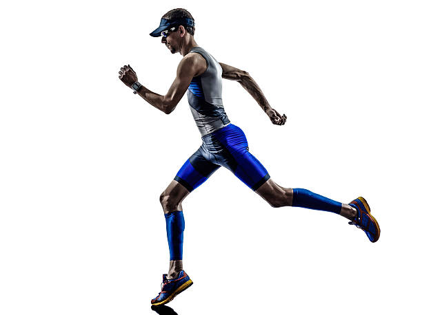 istock man triathlon iron man athlete runners running 516909119
