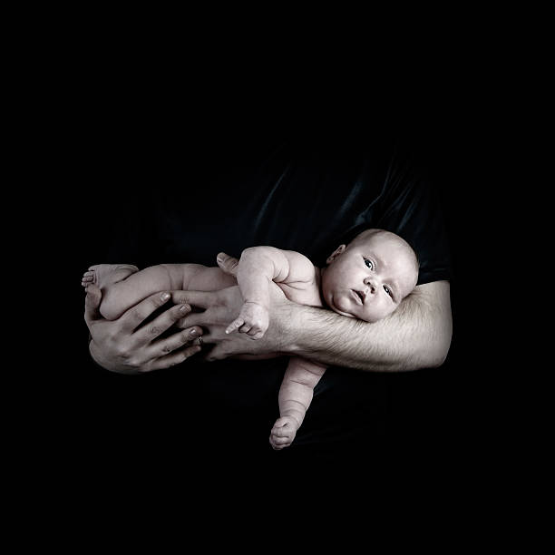 istock Newborn baby on the fathers hands 516909301
