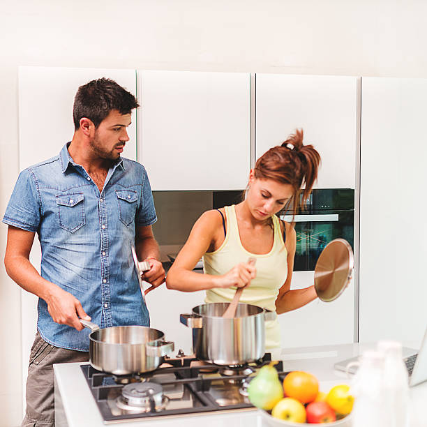 istock busy couple cooking in the kitchen 516909687
