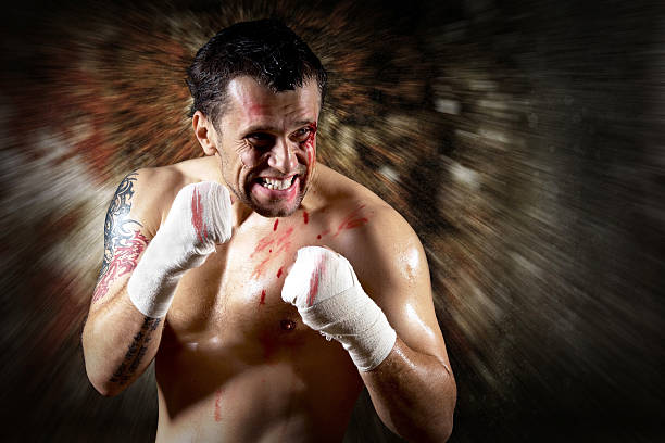 istock Aggressive boxer with blood on the face 516912183