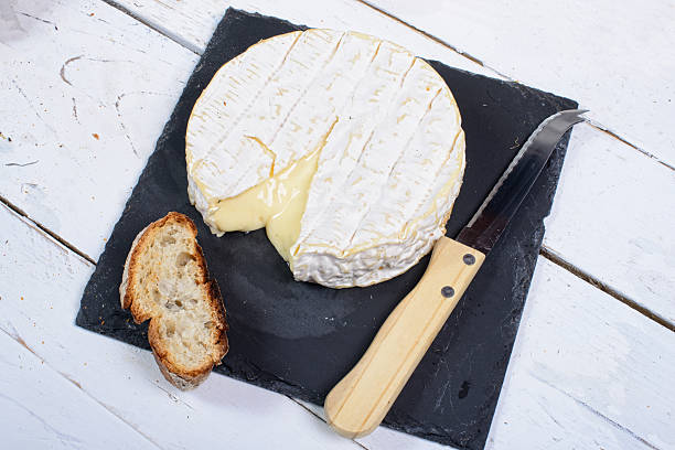 istock Camembert cheese on a plate slate 516914235