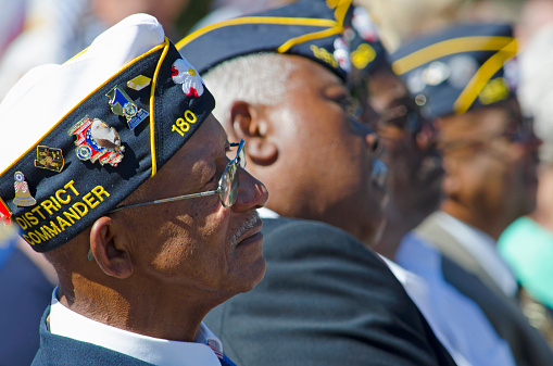 Belmont, North Carolina, USA - October 4, 2014: World War II Veterans give their attention to North Carolina Governor, Pat McCrory during a speech dedicating of a statue to honor the Veterans of World War II.