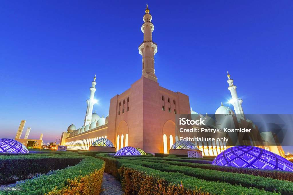 Sheikh Zayed Grand Mosque in Abu Dhabi at night Abu Dhabi, United Arab Emirates - March 27, 2014: Architecture of Sheikh Zayed Grand Mosque in Abu Dhabi at night, capital of United Arab Emirates. Abu Dhabi Stock Photo