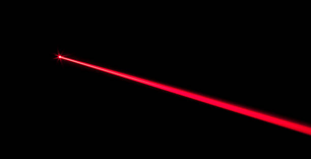 Laser Beam Red real laser beam on black background laser stock pictures, royalty-free photos & images