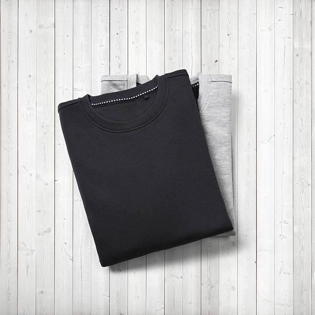 istock Two blank jumpers on white wood background 516916163