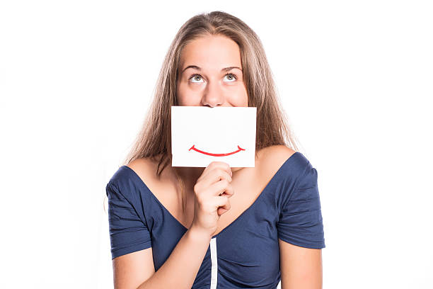 istock Young woman holding white board on white isolated background 516916381