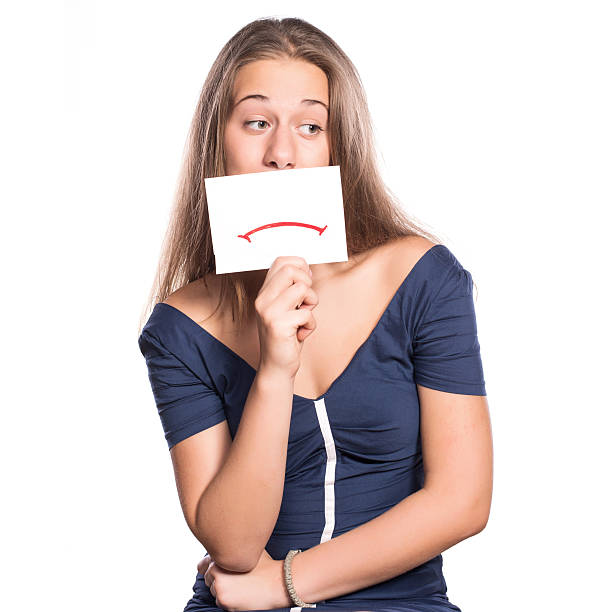 istock Young woman holding white board on white isolated background 516916391