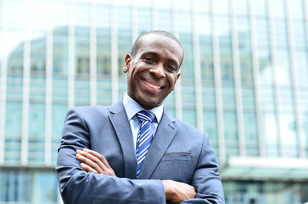 istock Confident businessman outside his office 516916451