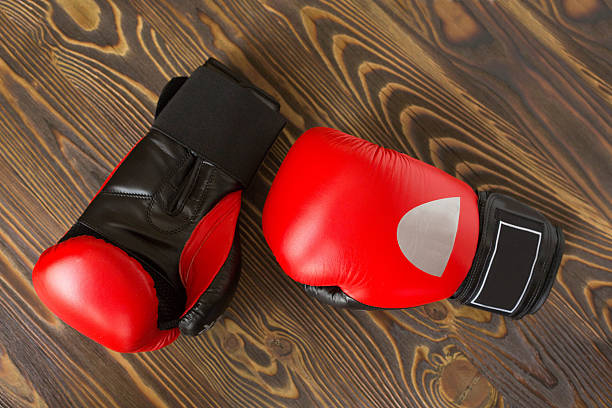 istock red and black boxing gloves on the wood 516919032