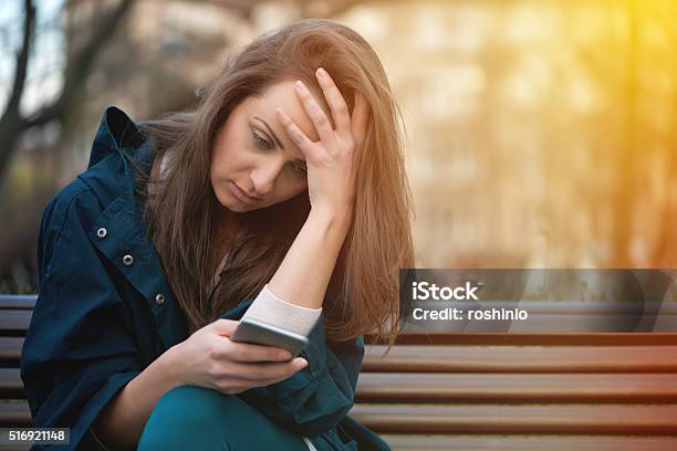 Bad News Over The Phone Stock Photo - Download Image Now - People, Fear, Smart Phone