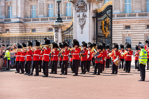 London, UK - June 12, 2006: British Royal guards performing the changing of the Guard at Buckingham Palace. The ceremony is one of the top attractions in London