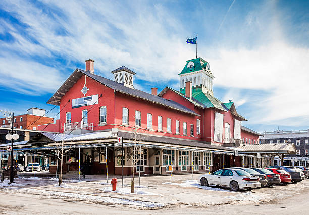 The public market of Saint-Hyacinthe. Saint-Hyacinthe, Canada- February 19 2016. The public market in the city of Saint-Hyacinthe on a sunny winter day. Motor vehicles parked around the building. Public Market St- Hyacinthe existed for almost 180 years. Built in 1830, it is the oldest public markets in Quebec. It has retained its original purpose while respecting the trends of today, which makes it a unique specialty market. saint hyacinthe photos stock pictures, royalty-free photos & images