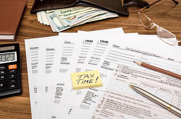 istock Time for taxes with money 516921828
