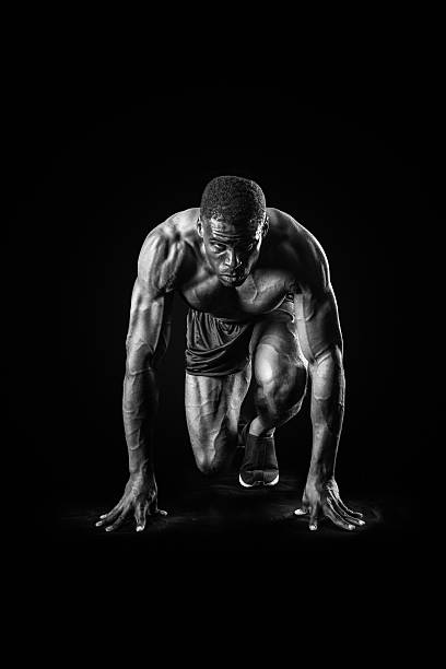 istock Muscular Man In Starting Position Of A Race 516922576