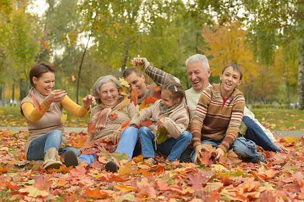 istock Family relaxing in autumn park 516924082