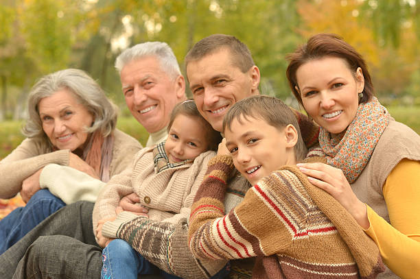 istock Family relaxing in autumn park 516924464
