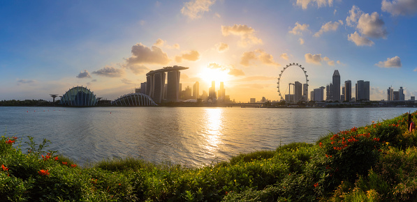 Cityscape panorama of Singapore city skyline at sunset in Marina Bay