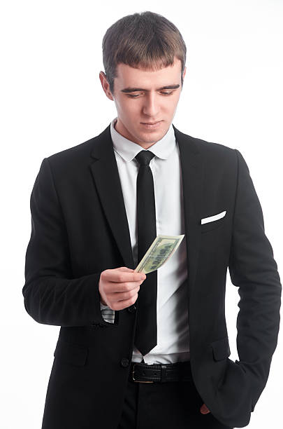 istock Man in suit with money 516925492