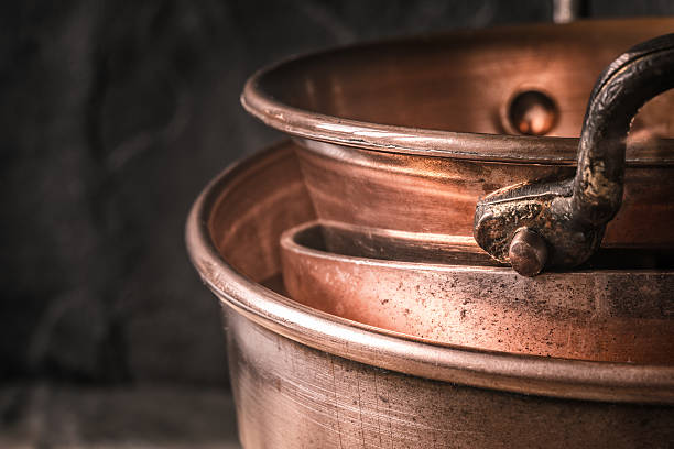 istock Copper pots and pans on the blurred background 516926368
