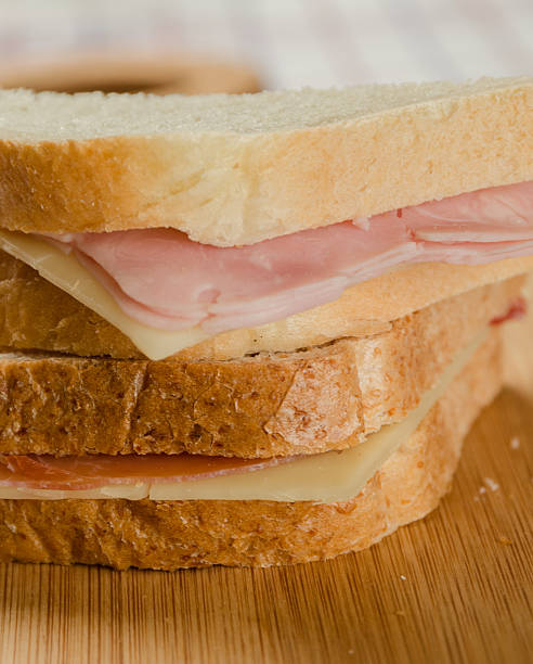istock Ham and Cheese Sandwiches with both White and Wholemeal Bread 516927110