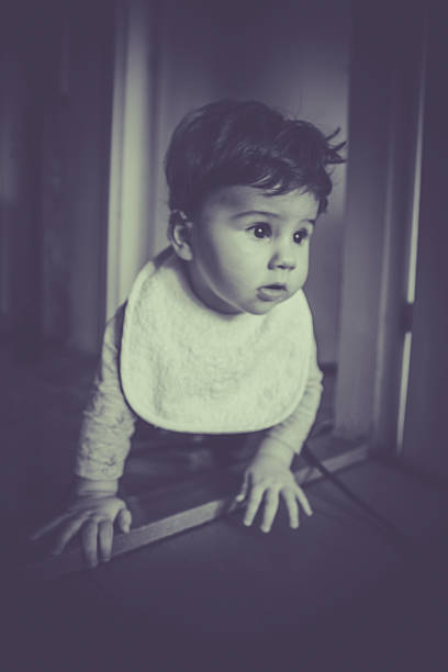 istock Crawling child at home on floor 516927758