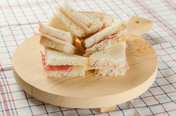 istock Ham and Cheese Small Sandwiches on the Cutting Board 516927896