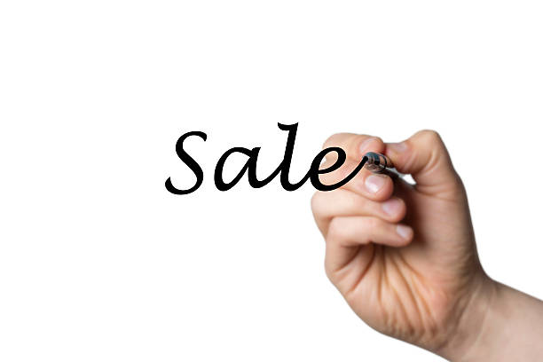 istock Sale written by a hand 516928914