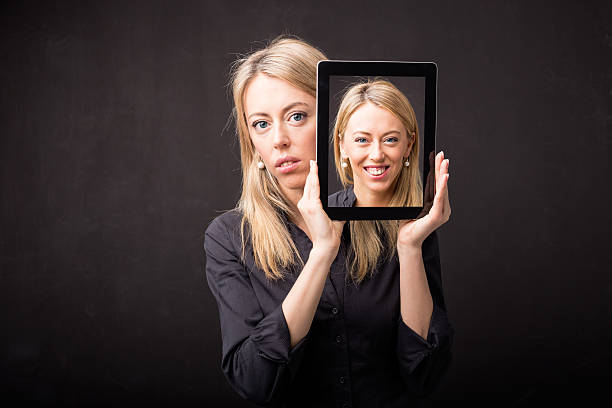 Woman showing happy portrait on tablet Woman showing happy portrait on tablet two objects photos stock pictures, royalty-free photos & images