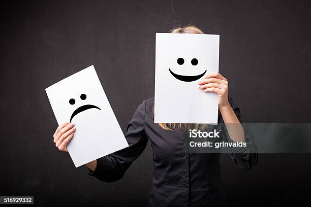 Woman Changing Smileys On Her Face Stock Photo - Download Image Now - Positive Emotion, Change, Emotion