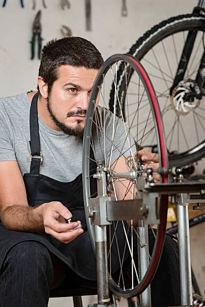 istock Bike Mechanic At Work In a Workshop 516930698