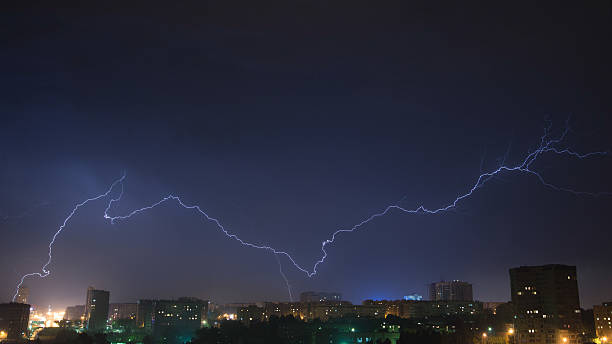 istock Night sky with lightning over the city 516933642