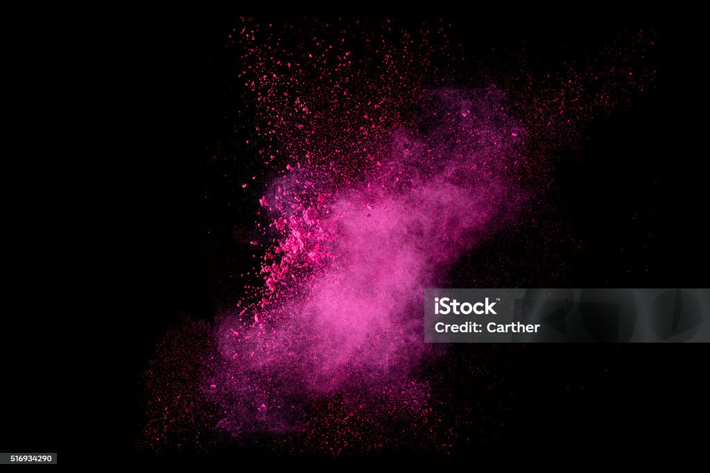 Explosion de couleurs. Particules de poussière seul sur fond noir - Photo de Rose libre de droits