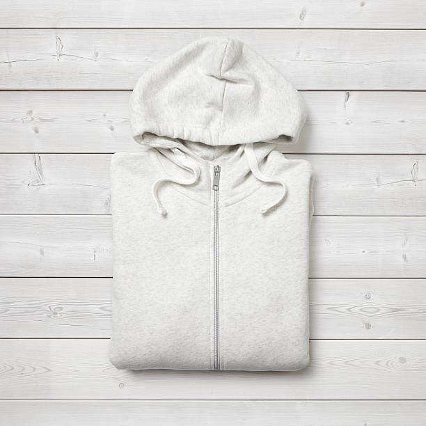 istock White hoodie on white wood background 516942859