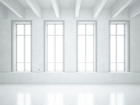 Loft space with white walls and white floor