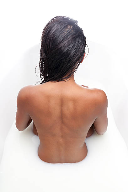 istock Strong back woman in a milk bath 516946165