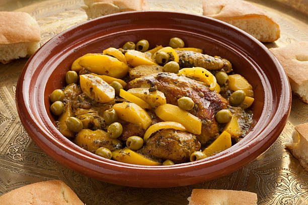Moroccan tajine with chicken,pototoes and olives Traditional moroccan tajine with chicken,pototoes and olives tajine stock pictures, royalty-free photos & images