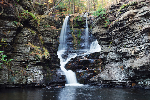 Waterfall with trees and rocks in mountain in Autumn. From Fulmer Falls Pennsylvania Dingmans Falls.