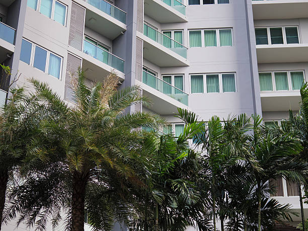 istock condominium with garden, urban trees 516947233