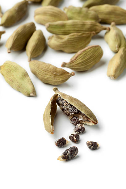 istock Green cardamom pods and seeds close up 516947244