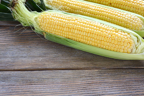 istock ears of fresh sweet corn on the boards 516947279