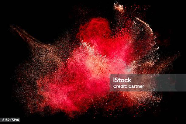 Colorful Dust Particle Explosion Isolated On Black Stock Photo - Download Image Now - Red, Exploding, Abstract
