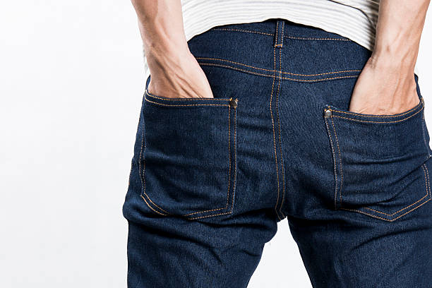 istock man with his hands in jeans pockets 516949545