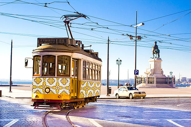 Lisbon trams Vintage yellow tramway at the Commerce Square in Lisbon, Portugal lisbon photos stock pictures, royalty-free photos & images