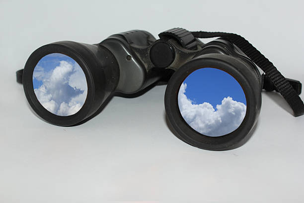 istock The sky reflected in a pair of binoculars 516954984