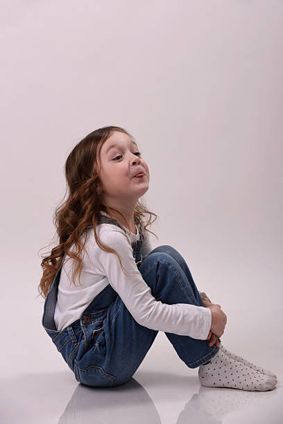 istock Girl is showing her toungue 516955840