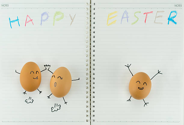 istock Happy eggs celebrates Easter, with children's drawing on blank paper 516958560